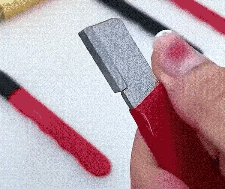 Compact handheld blade sharpener in use